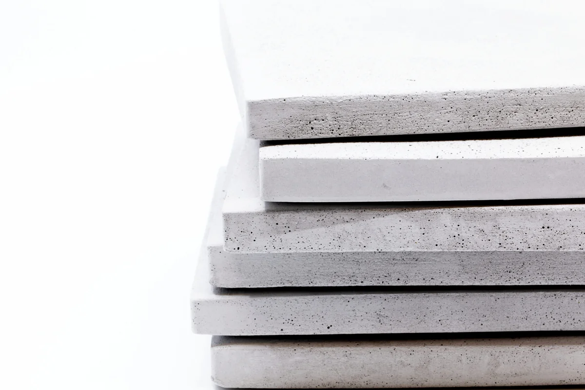 Cut edge of a Rumett panel — the colour continues into the body, with no paper core