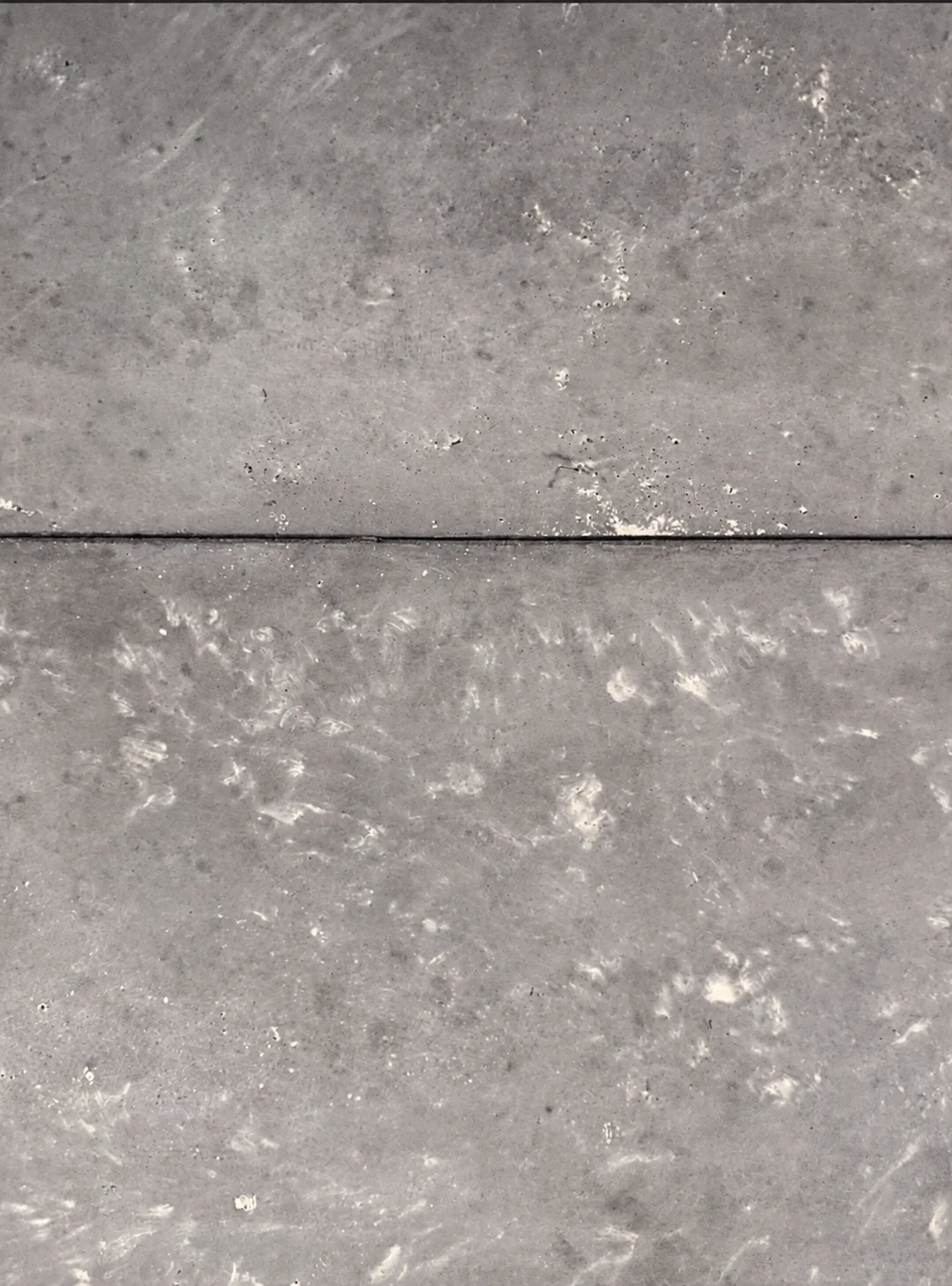 Close view of two Rumett panels meeting at a joint, with cast variation on both faces