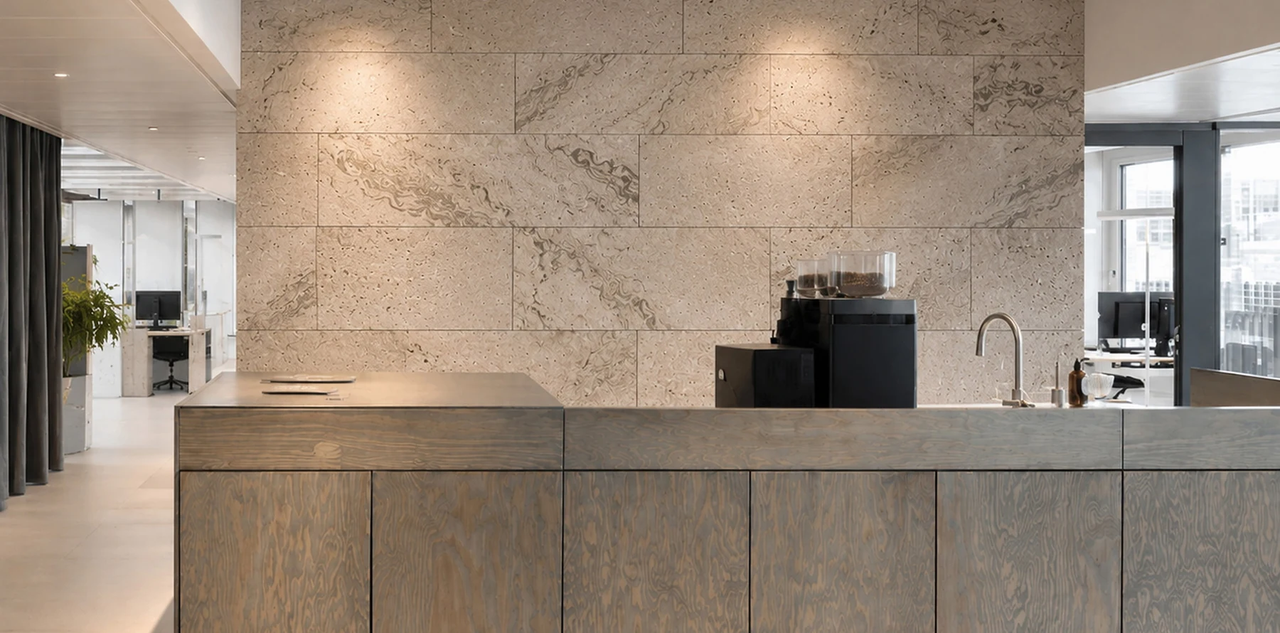 A Rumett panel wall in a workplace interior, showing the joint rhythm across the surface